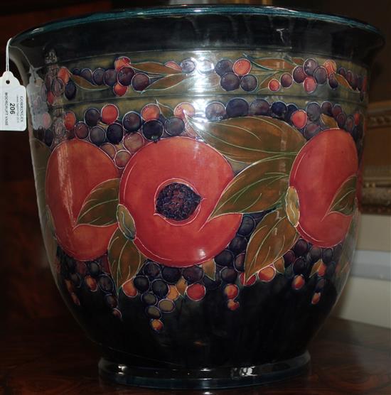 A large William Moorcroft pomegranate pattern jardiniere, dated 1919, 31.5 x 36cm, damage